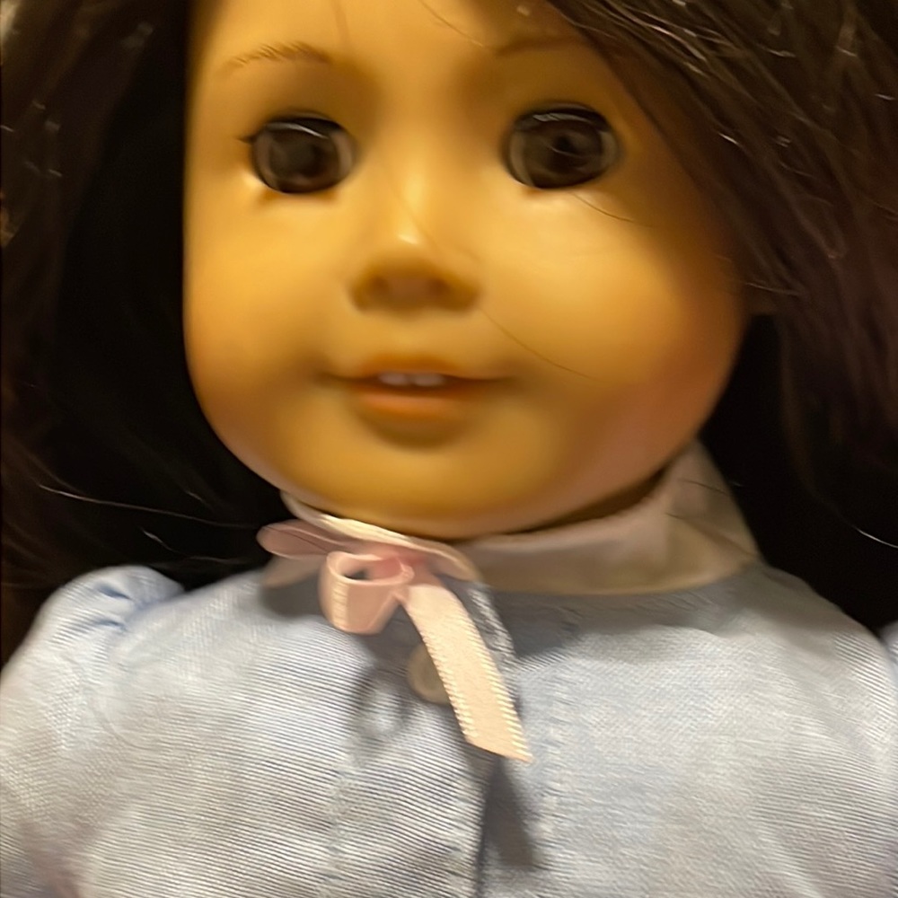 For sale American Girl doll.  She has long black hair and brown eyes.
